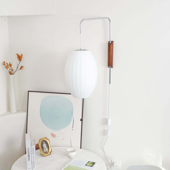 Moderne væglampe med kugledesign og varmt hvidt lys