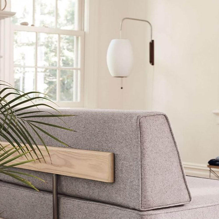 Moderne væglampe med kugledesign og varmt hvidt lys