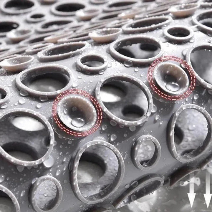 Antibakteriel, skridsikker brusemåtte i blå, ideel til sikre brusebade, tilgængelig i forskellige størrelser.