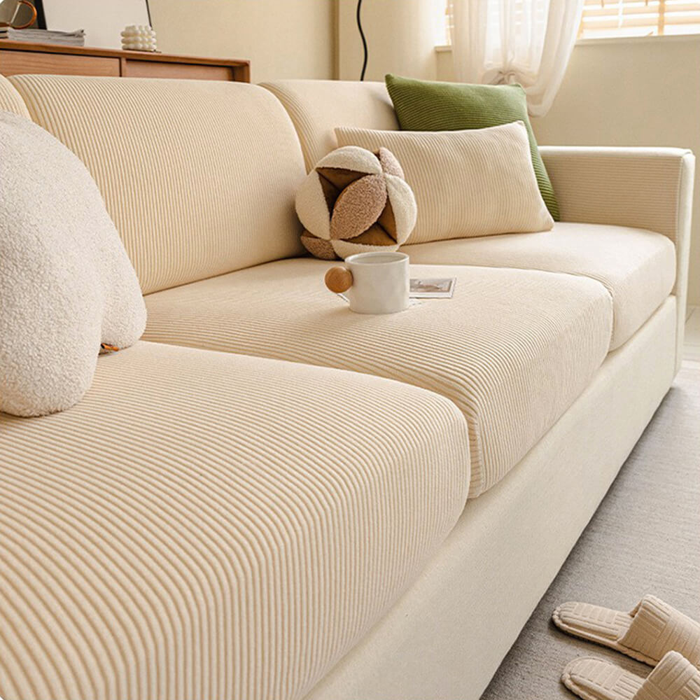 Elastisk fløjls-sofabetræk med elegante lodrette striber, passer til moderne stuer.