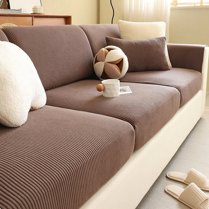 Elastisk fløjls-sofabetræk med elegante lodrette striber, passer til moderne stuer.