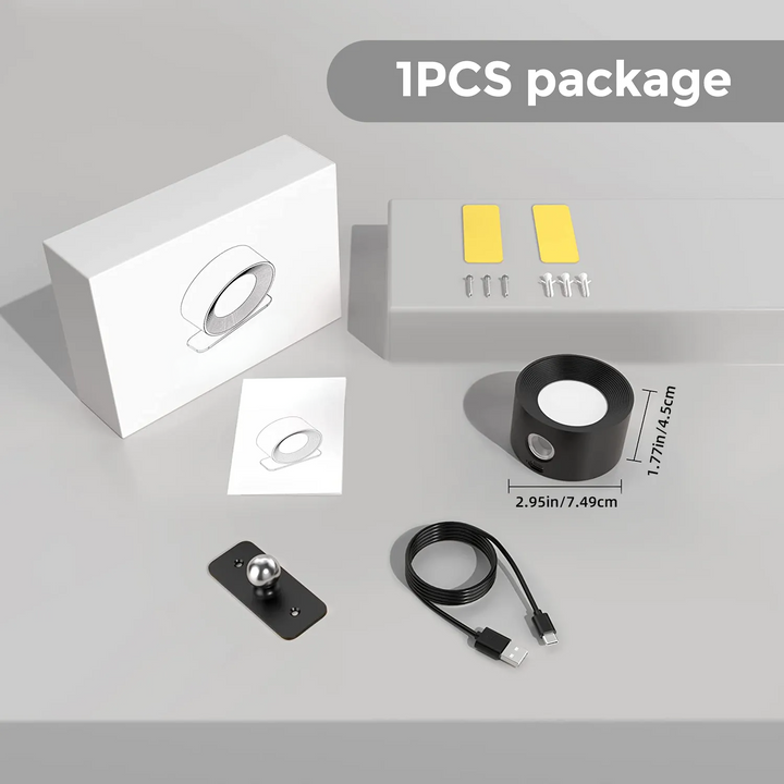 Elegant trådløs væglampe i sort set fra siden, med dæmpbart LED-lys og 360° drejelig funktion for fleksibel positionering.