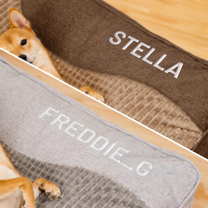 Sidebillede af en hundeseng med hævet hovedstøtte, der fremmer en sund holdning og lindrer tryk på rygsøjlen.