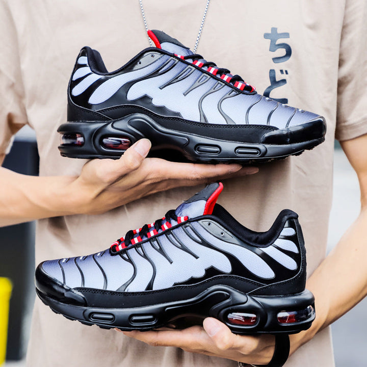 Sorte og grå Air Cushion løbesko for komfort og stil, med skridsikker sål og polstret indersål, ideelle til sport.