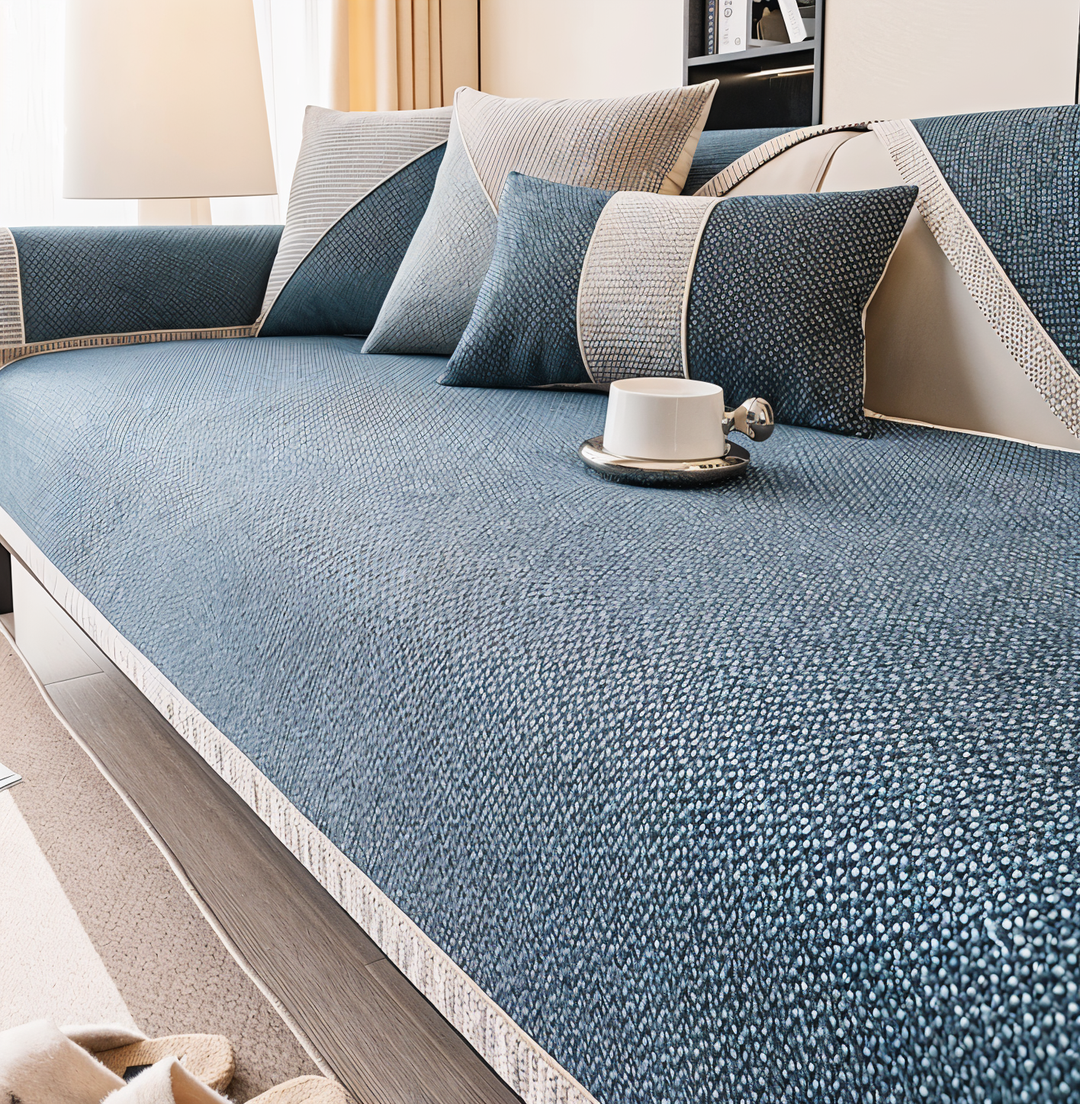 Optimal beskyttelse og frisk lysegrå stil med dette skridsikre sofabetræk.