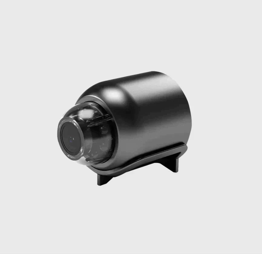 Ultrakompakt WiFi-overvågningskamera med 1080P HD, nattesyn og vidvinkelobjektiv, diskret og kompakt til indendørs brug.