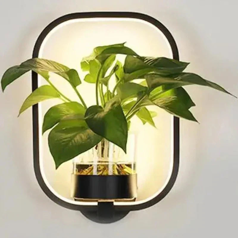 Elegant LuminaireSconce plantevæglampe i glas med naturligt design, perfekt til stilfulde interiører, oplyst med koldt eller varmt hvidt lys.
