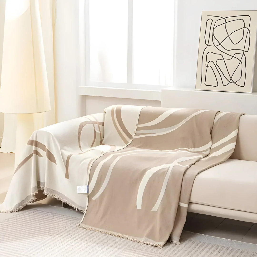 Vendbart sofabetræk, moderne design, to sider, beskytter mod pletter og slid, fås i grå og khaki.