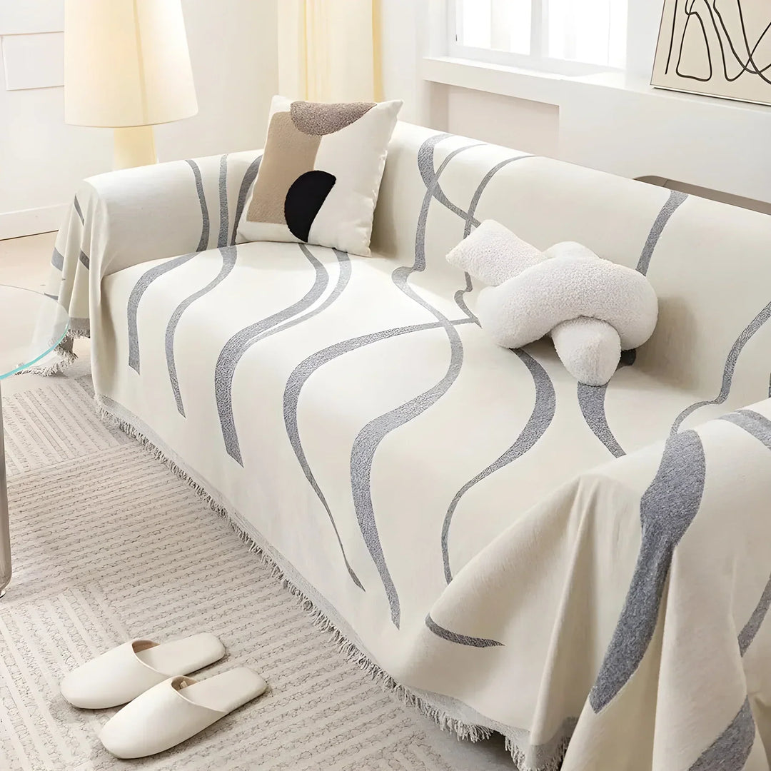 Vendbart sofabetræk, moderne design, to sider, beskytter mod pletter og slid, fås i grå og khaki.